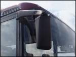 Spiegel des Neoplan Transliner von G�strow-Club-Reisen aus Deutschland im Stadthafen Sassnitz.