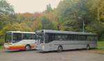 Ein Mercedes-Benz O 407 und O 408 von Busverkehr Imfeld, abgestellt auf einem Gro�parkplatz f�r Park-and-Ride-Busse am 20.10.2013.